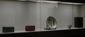 Museum display at the Crafts Gallery behind glass