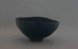 Small snake kiln fired ceramic bowl