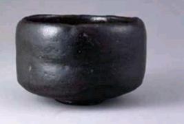 Small black raku ware tea bowl